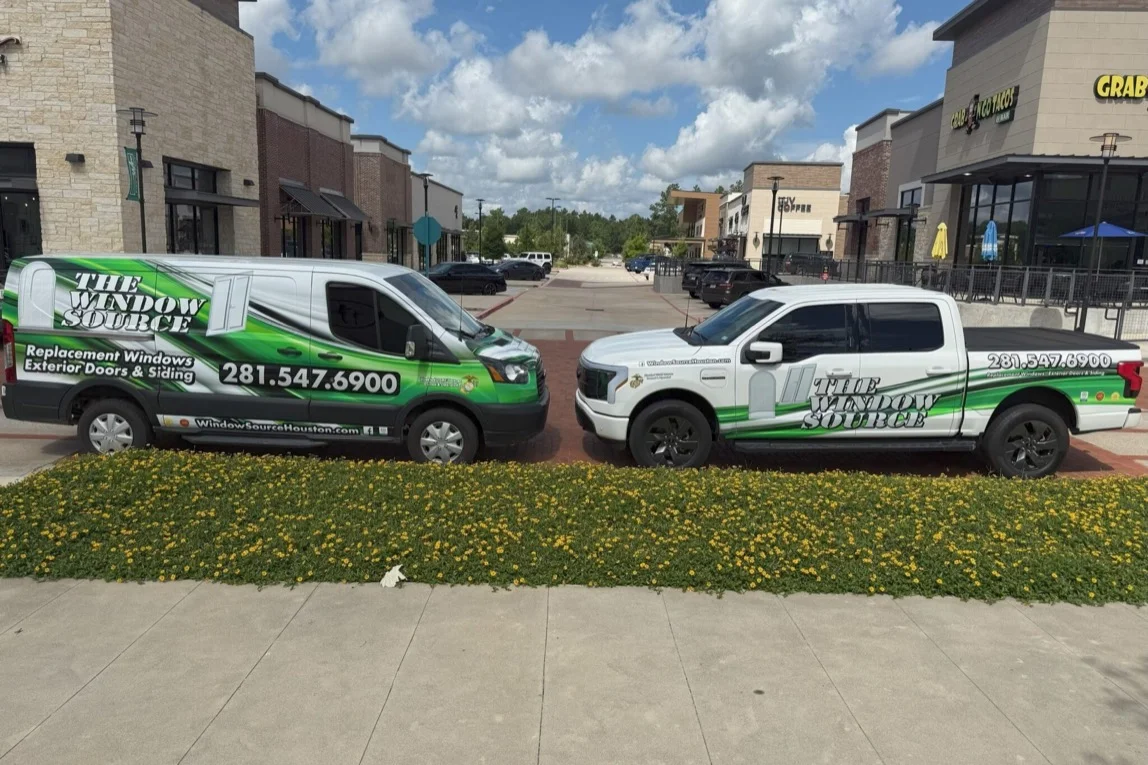 A Window Source of Houston van and pickup truck, both in company wrap